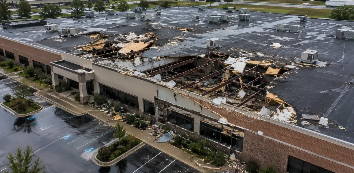 Aerial drone imagery documenting commercial building damage before repairs